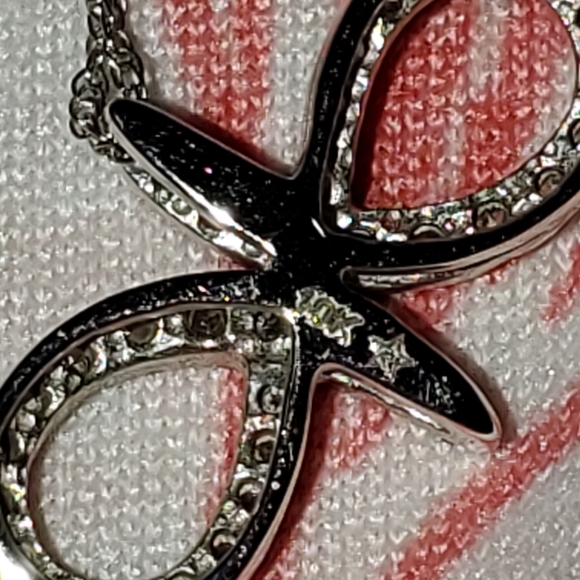 10k white gold and diamond infinity style necklace. - Picture 8 of 9